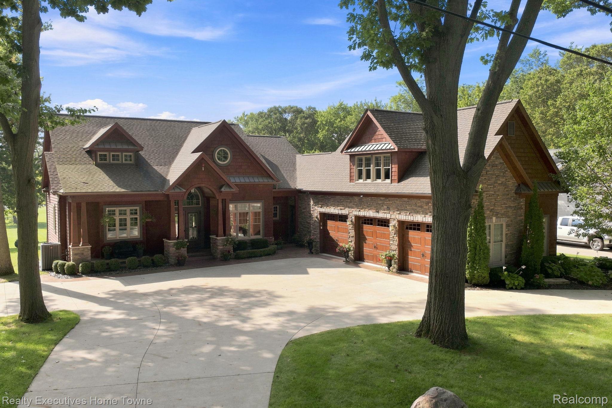 2829 Riverside Drive Port Huron, MI 48060 - Photo 2 of 99 Crafted exterior featuring wood siding and stone accents