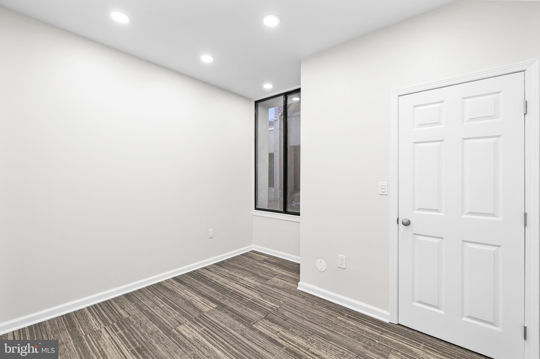 1615 Q Street Northwest, Unit T1 Washington, DC 20009 - Photo 24 of 42 an empty room with wooden floor and closet
