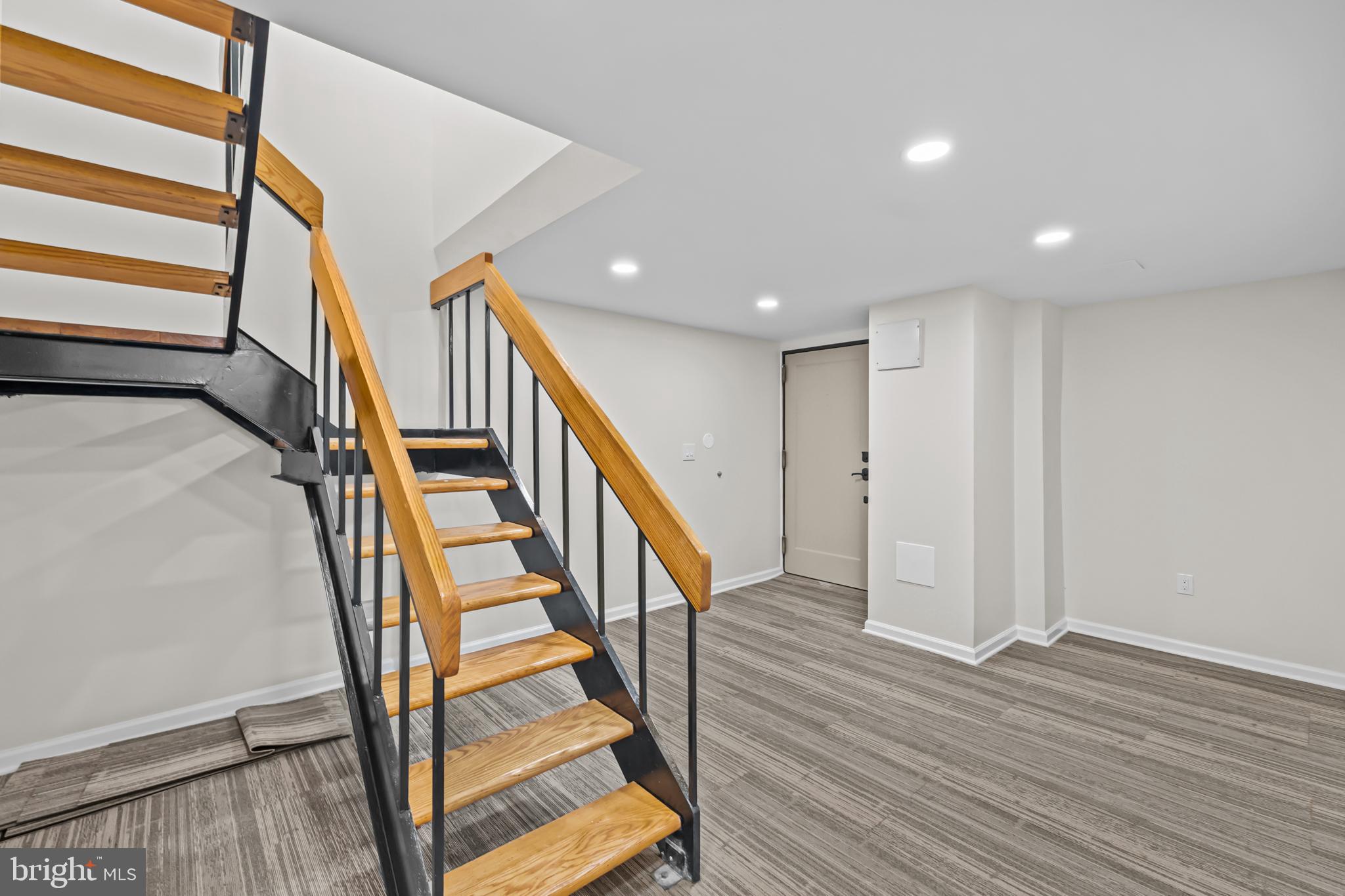 1615 Q Street Northwest, Unit T1 Washington, DC 20009 - Photo 4 of 42 a view of entryway with wooden floor and stairs