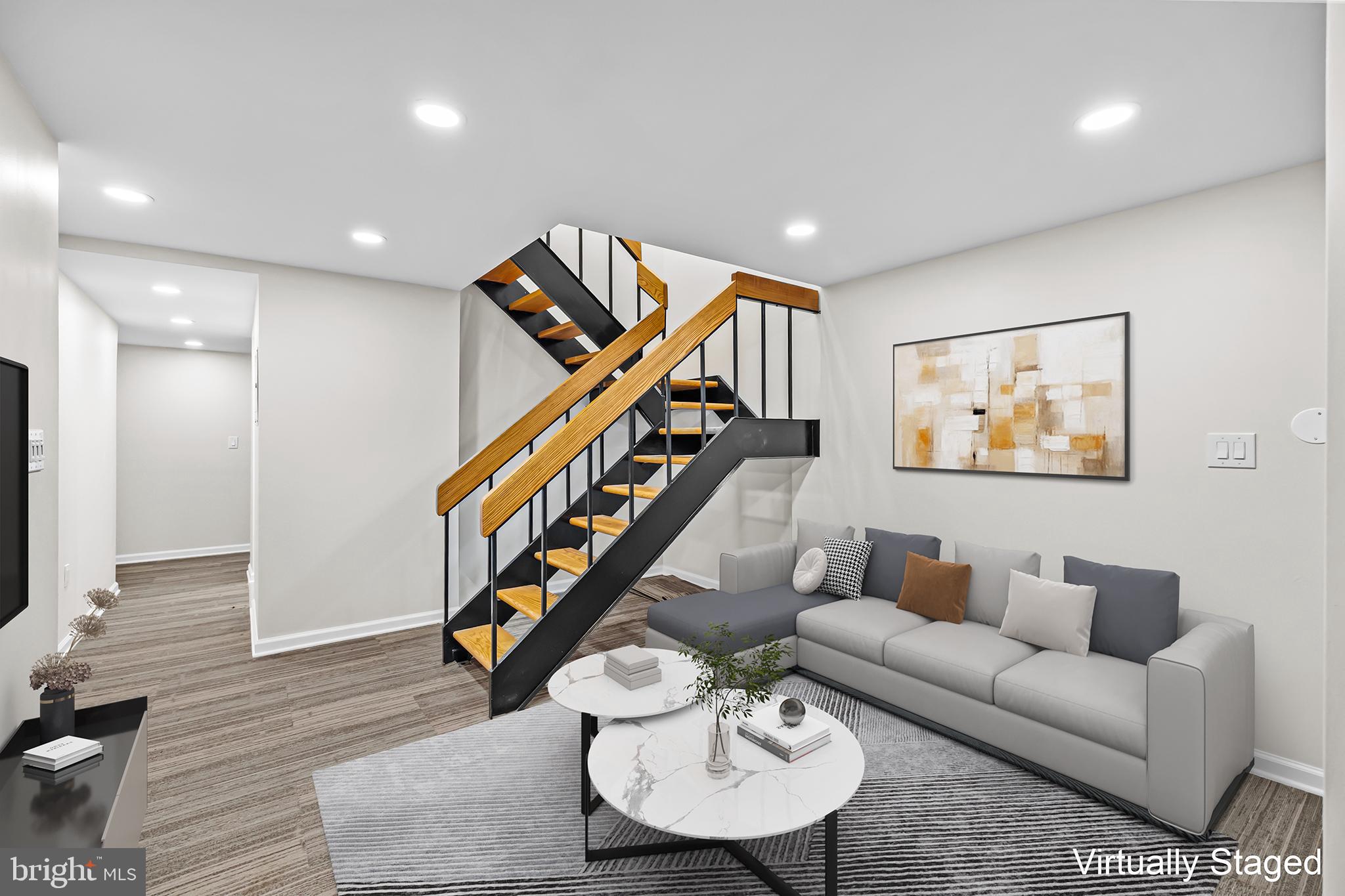 1615 Q Street Northwest, Unit T1 Washington, DC 20009 - Photo 6 of 42 a living room with furniture and a flat screen tv