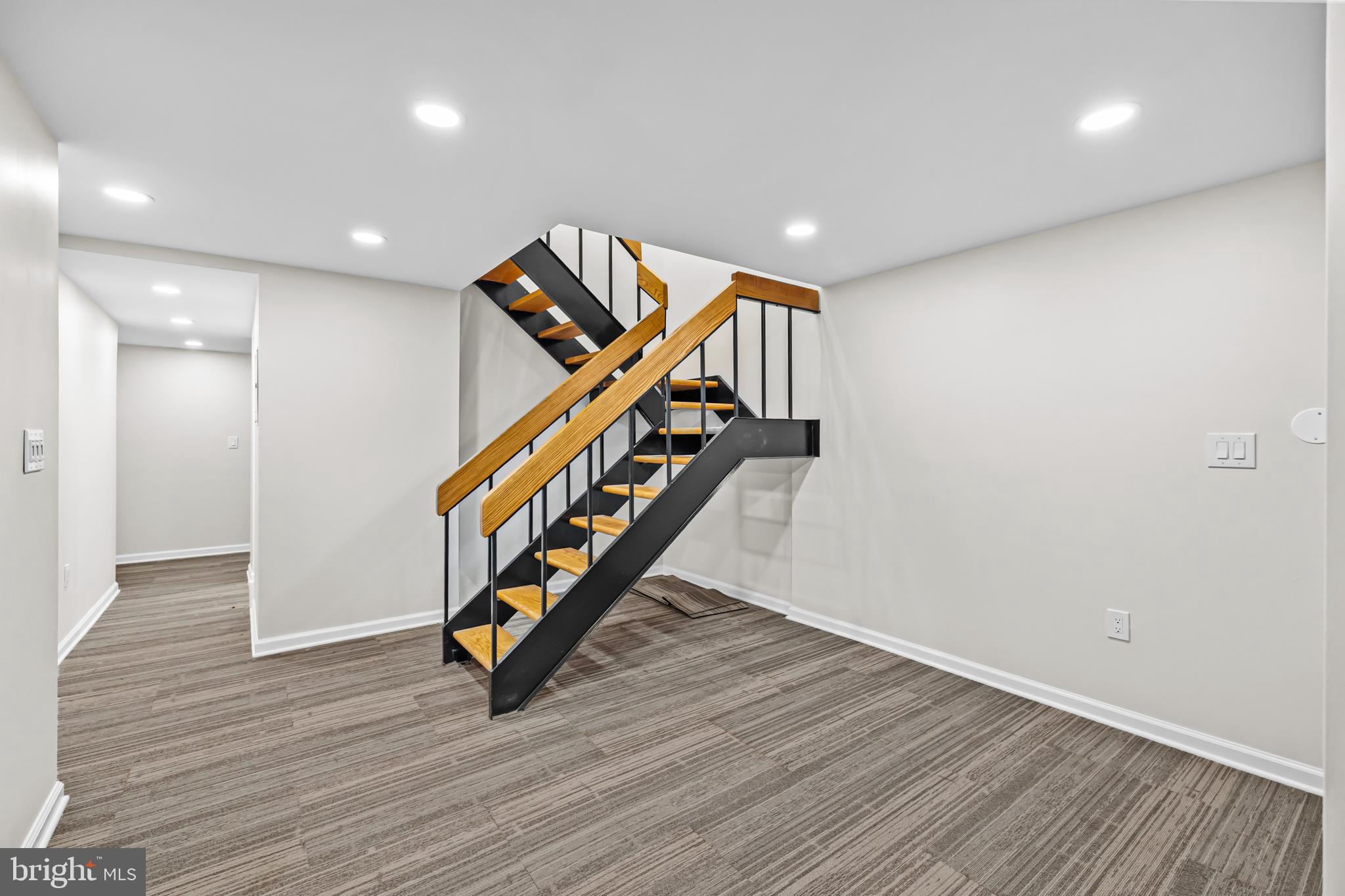 1615 Q Street Northwest, Unit T1 Washington, DC 20009 - Photo 7 of 42 a room with stairs and wooden floor