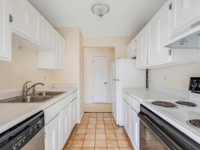706 Kiwanis Drive, Unit 4 Freeport, IL 61032 - Photo 12 of 23 a kitchen with a sink stove and cabinets
