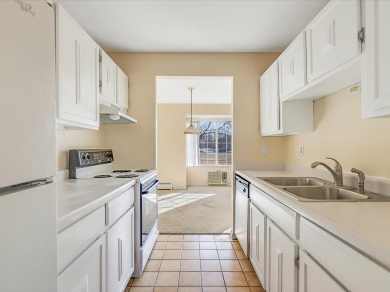 706 Kiwanis Drive, Unit 4 Freeport, IL 61032 - Photo 13 of 23 a kitchen that has a sink and a stove