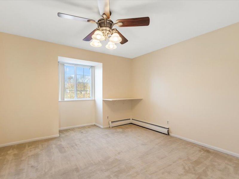 706 Kiwanis Drive, Unit 4 Freeport, IL 61032 - Photo 17 of 23 an empty room with a empty space and a ceiling fan