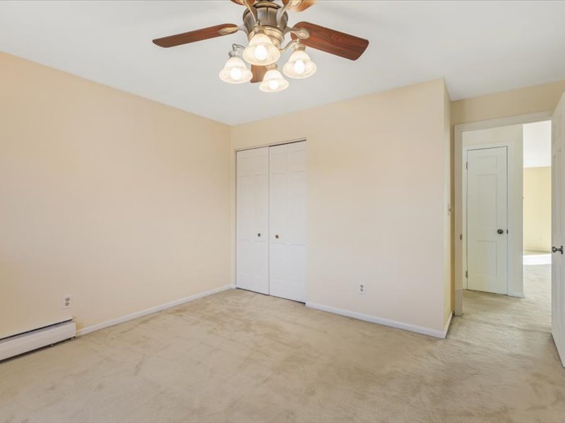 706 Kiwanis Drive, Unit 4 Freeport, IL 61032 - Photo 18 of 23 an empty room with a chandelier fan and a chandelier fan