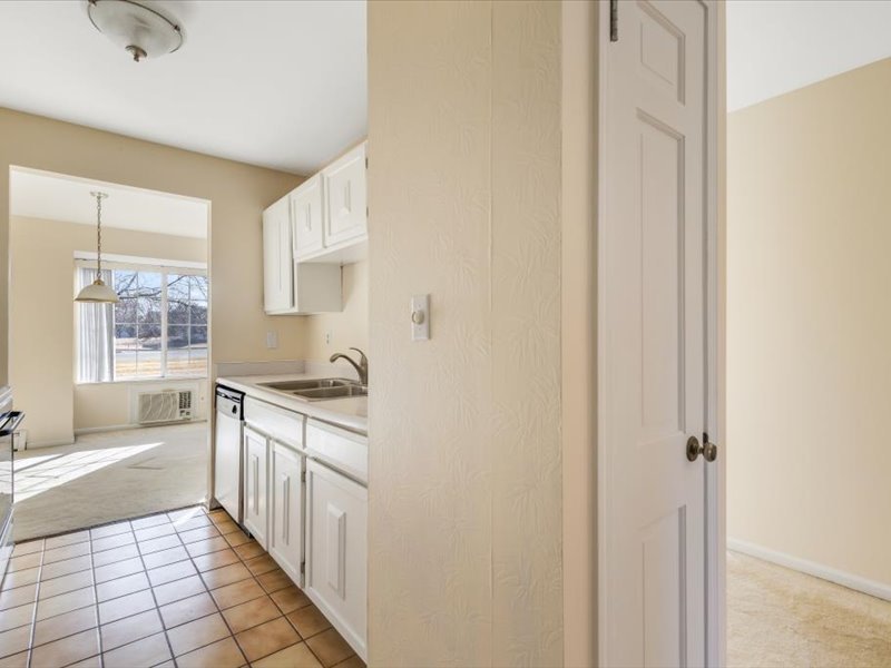 706 Kiwanis Drive, Unit 4 Freeport, IL 61032 - Photo 5 of 23 a kitchen with stainless steel appliances granite countertop a sink and a stove top oven