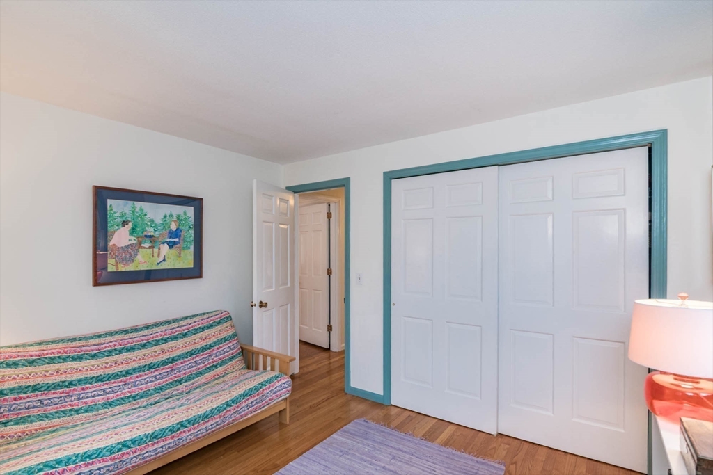 171 Aubinwood Road Amherst, MA 01002 - Photo 29 of 42 a bedroom with a bed and a table in it