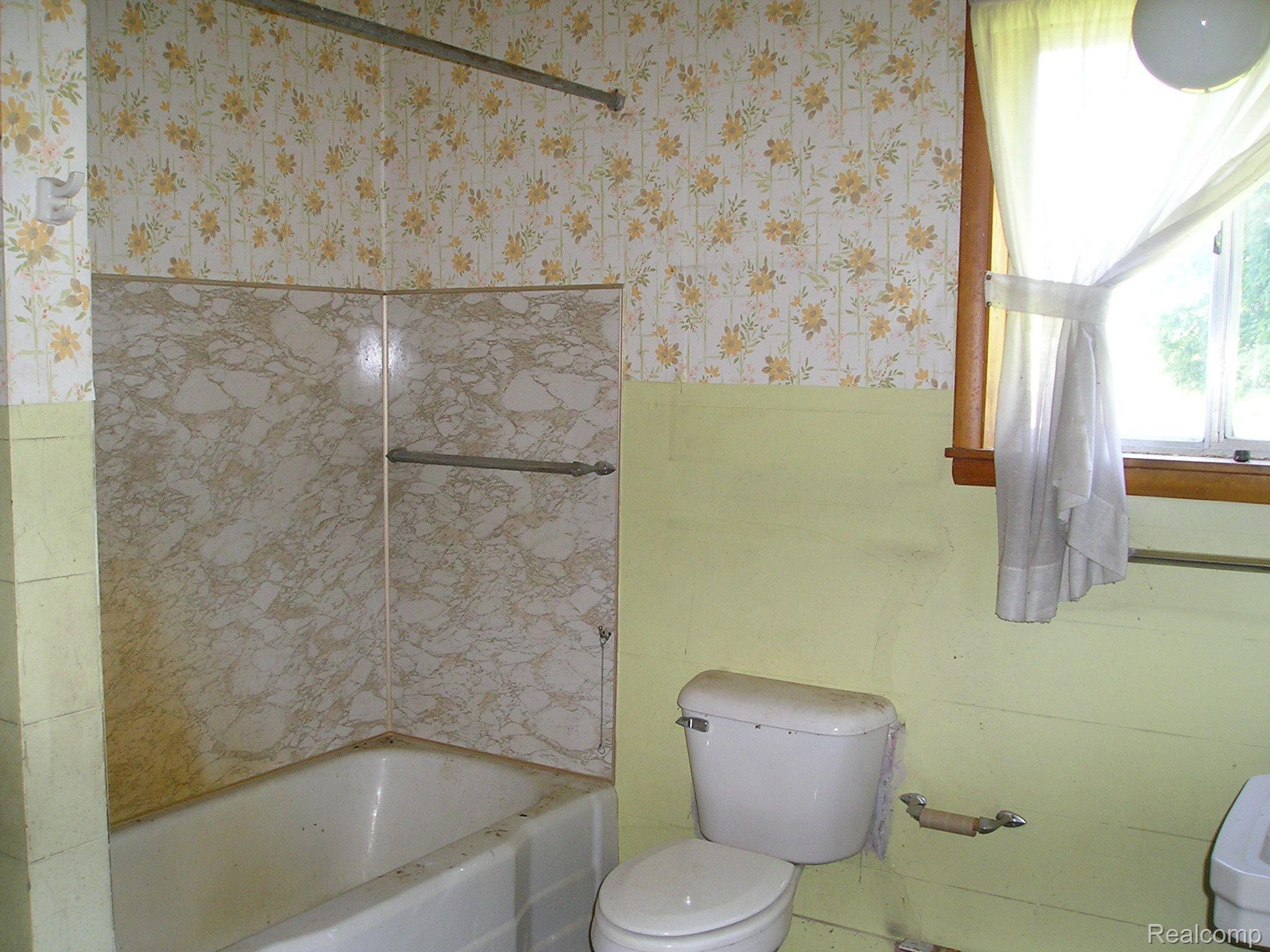 4249 East Hunters Creek Road Metamora, MI 48455 - Photo 3 of 19 Single bath on first floor.
