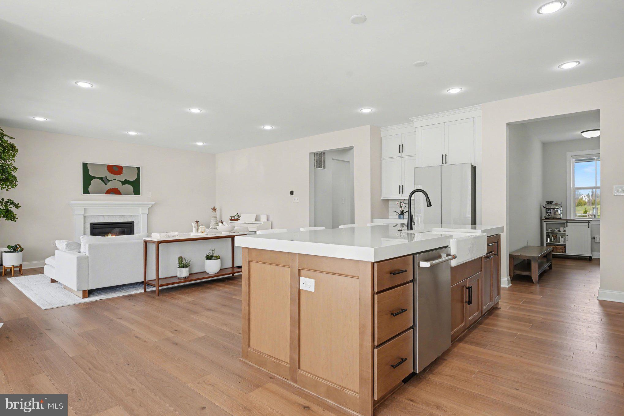236 Indian Creek Road Telford, PA 18969 - Photo 15 of 51 a large kitchen with stainless steel appliances kitchen island a large counter top and a wooden floors
