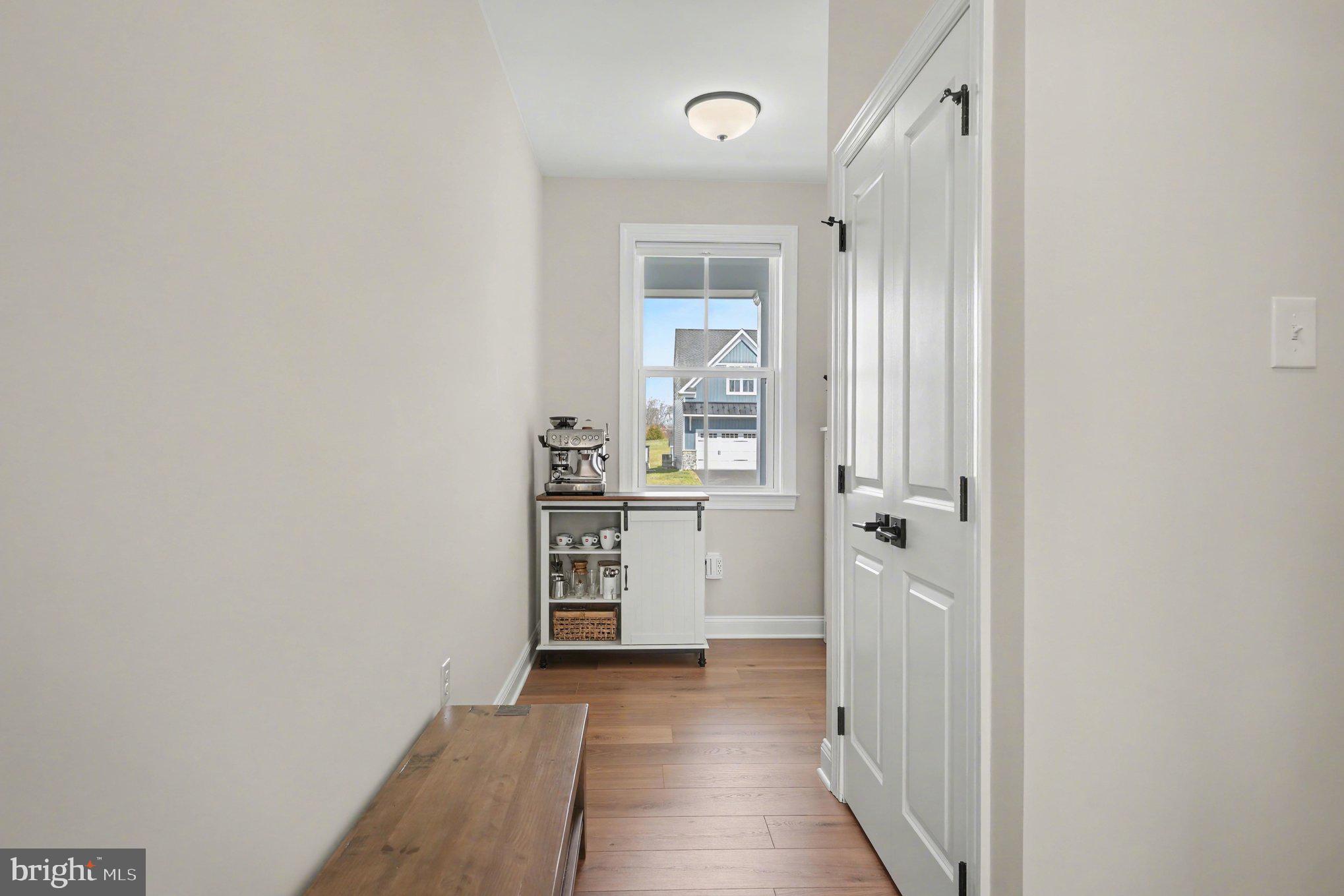 236 Indian Creek Road Telford, PA 18969 - Photo 21 of 51 a view of a hallway with wooden floor and a kitchen