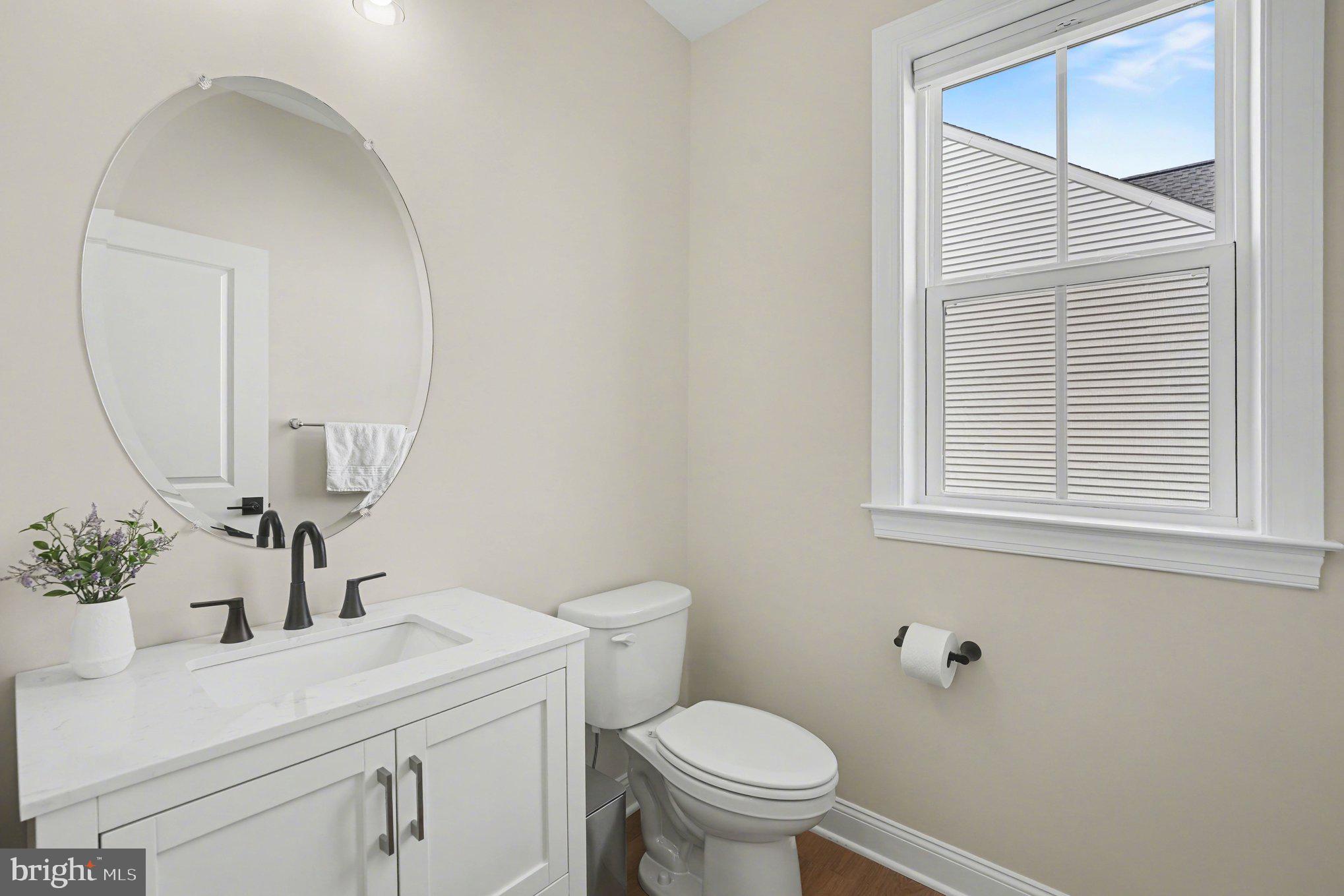 236 Indian Creek Road Telford, PA 18969 - Photo 22 of 51 a bathroom with a sink a toilet and mirror