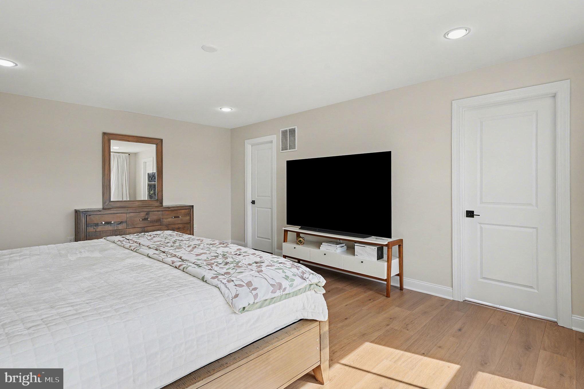 236 Indian Creek Road Telford, PA 18969 - Photo 29 of 51 a bedroom with bed table and flat screen tv