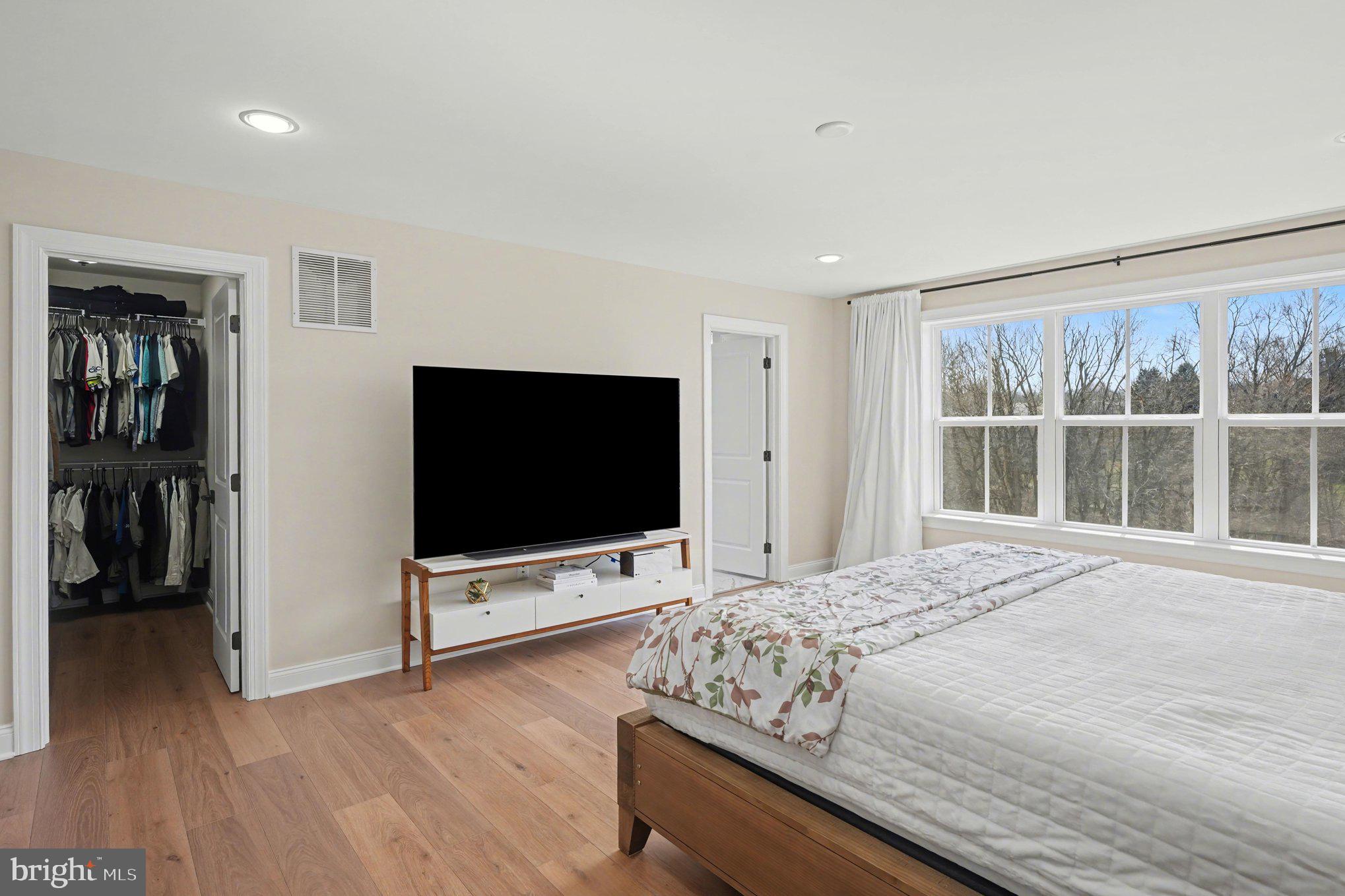 236 Indian Creek Road Telford, PA 18969 - Photo 30 of 51 a bedroom with a bed and a flat screen tv