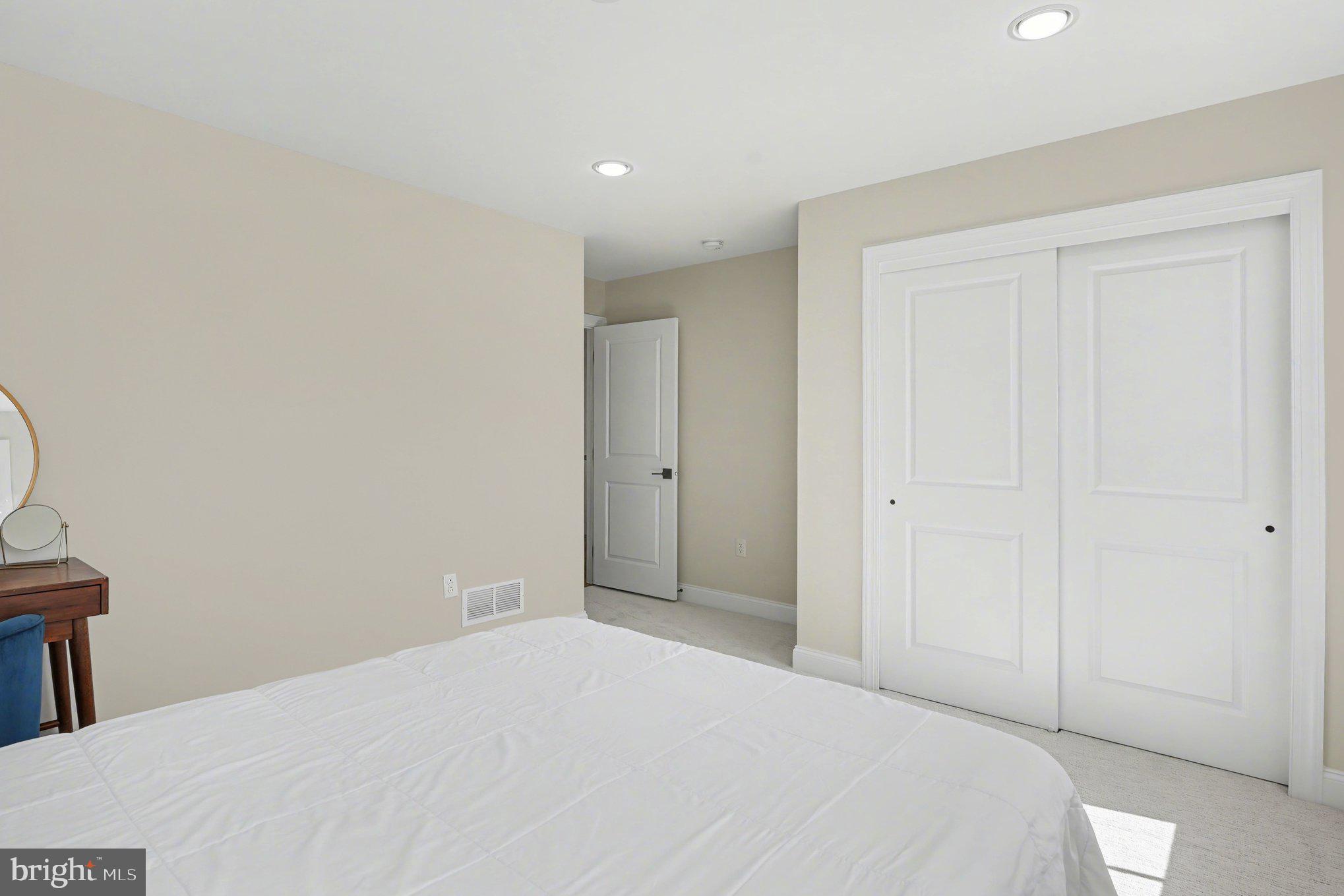 236 Indian Creek Road Telford, PA 18969 - Photo 35 of 51 a bedroom with a bed and a mirror