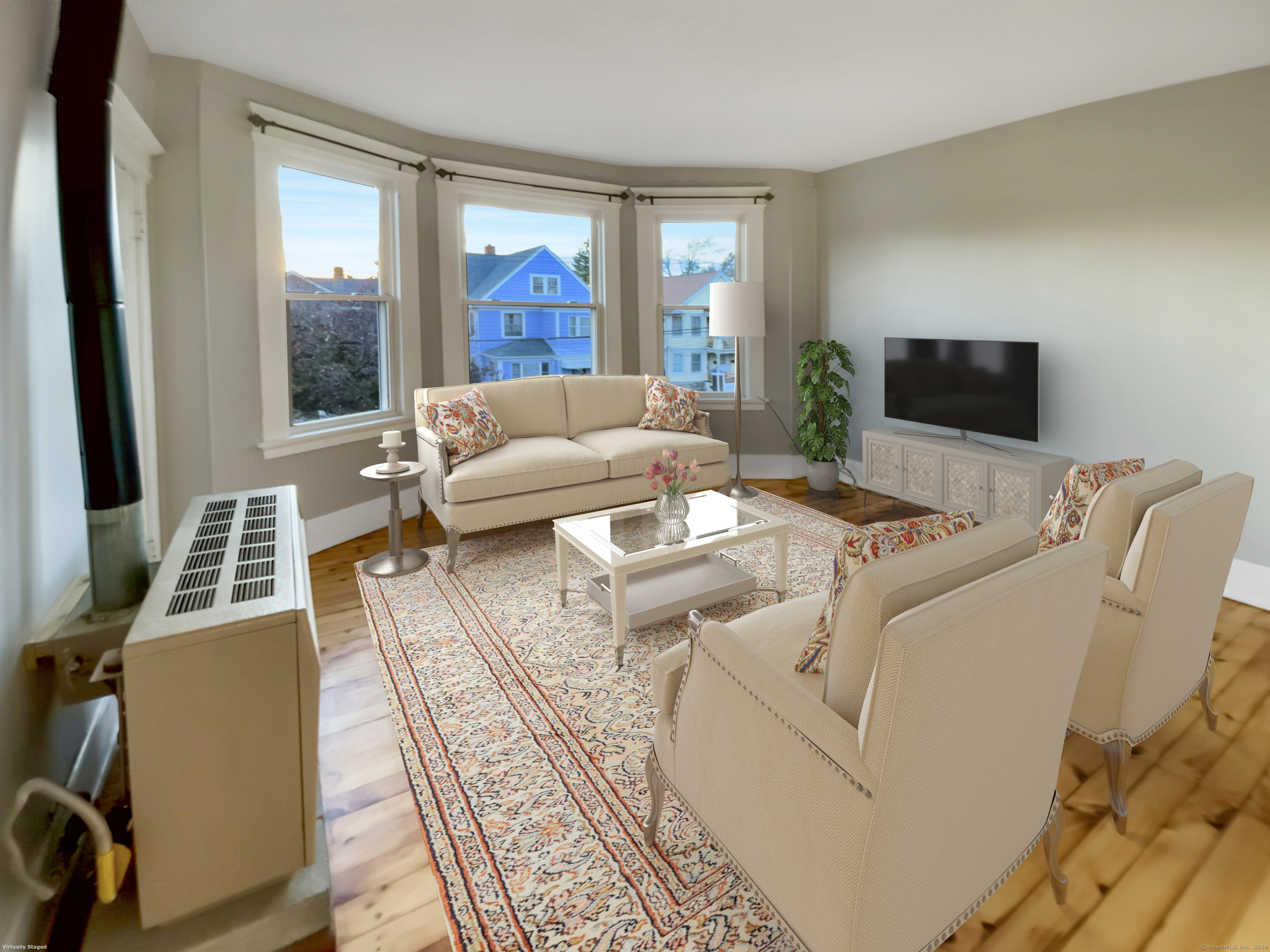 a living room with furniture and a flat screen tv