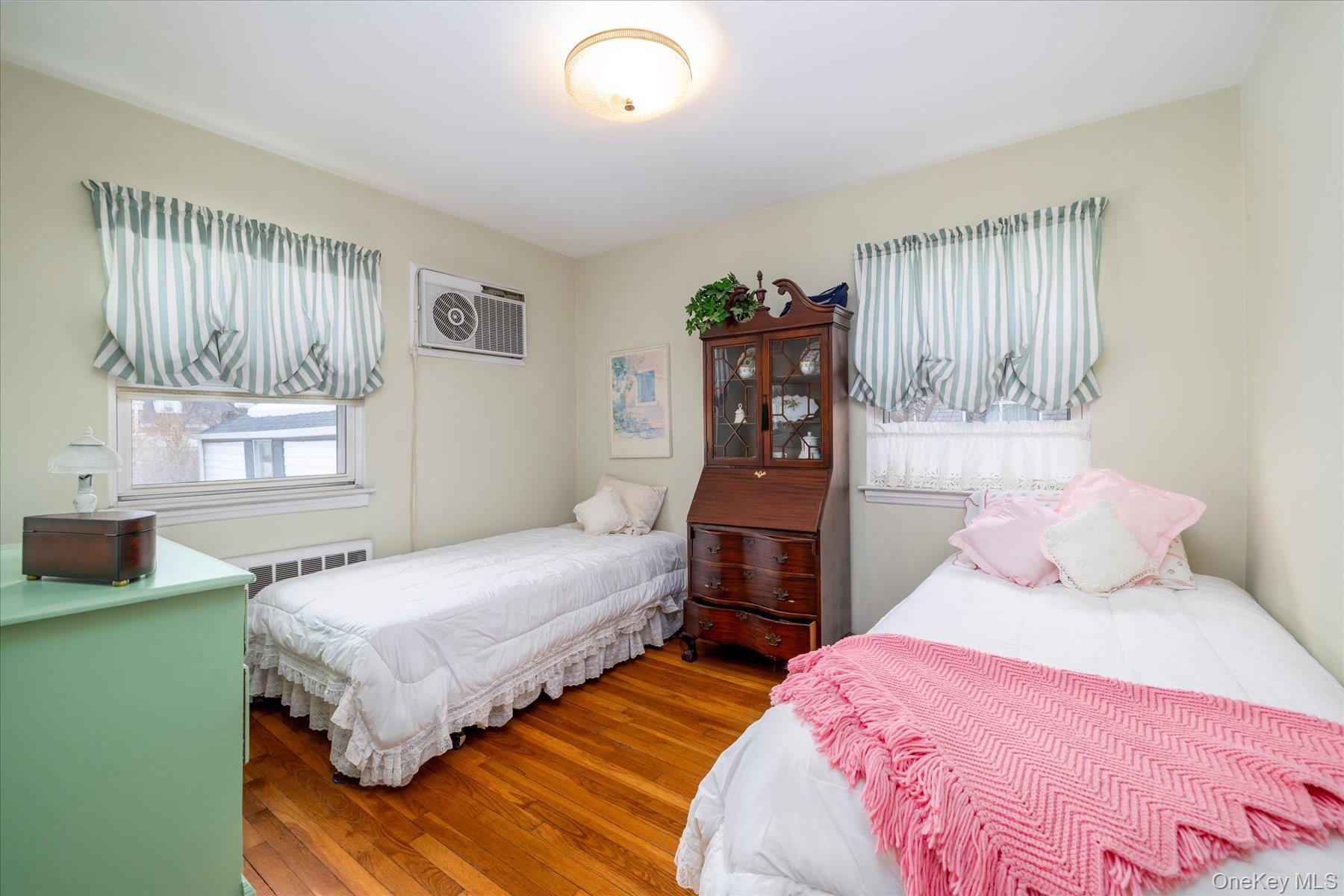 36 Wellsboro Road Valley Stream, NY 11580 - Photo 12 of 15 a bedroom with two beds and a window