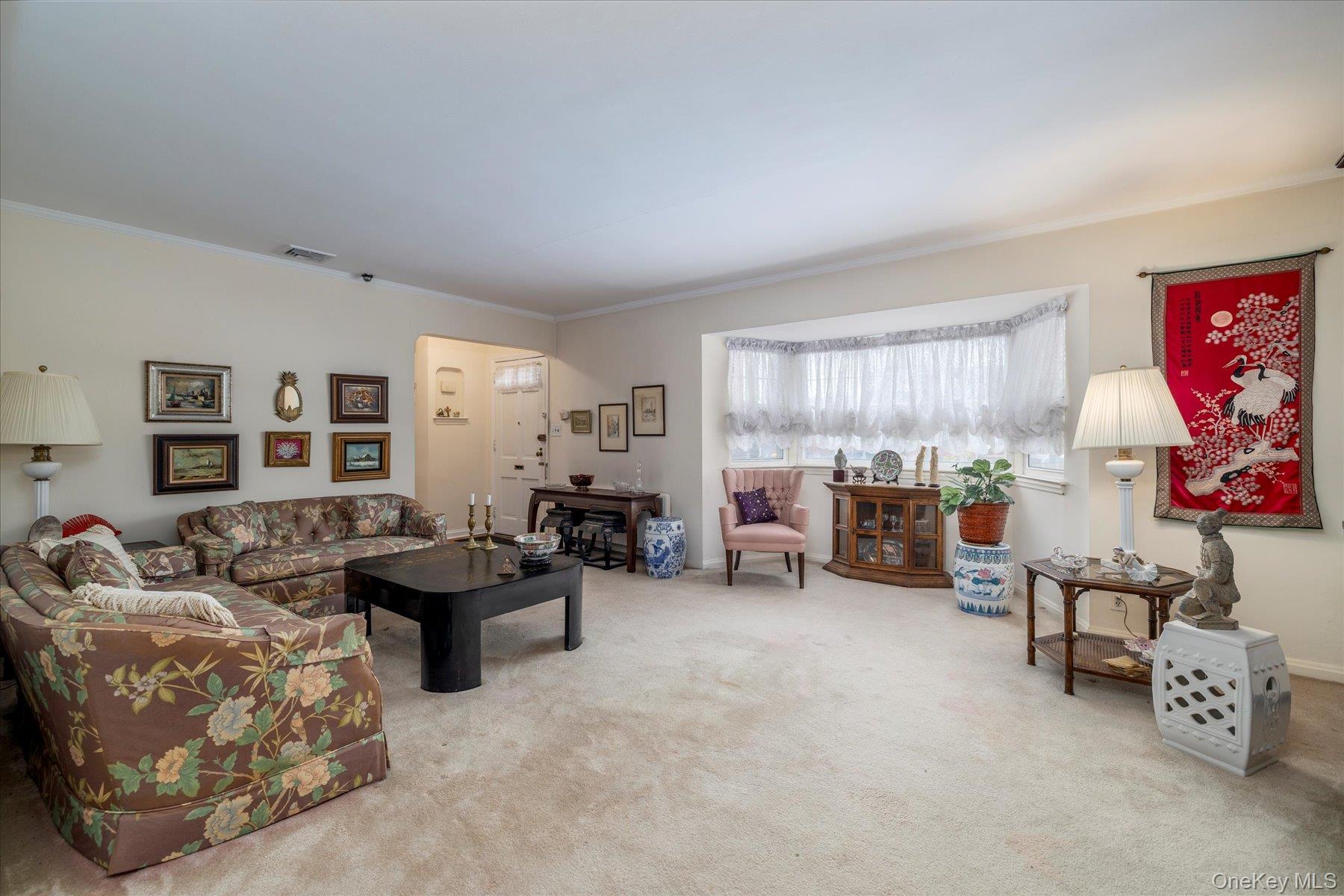 36 Wellsboro Road Valley Stream, NY 11580 - Photo 3 of 15 a living room with furniture and a flat screen tv