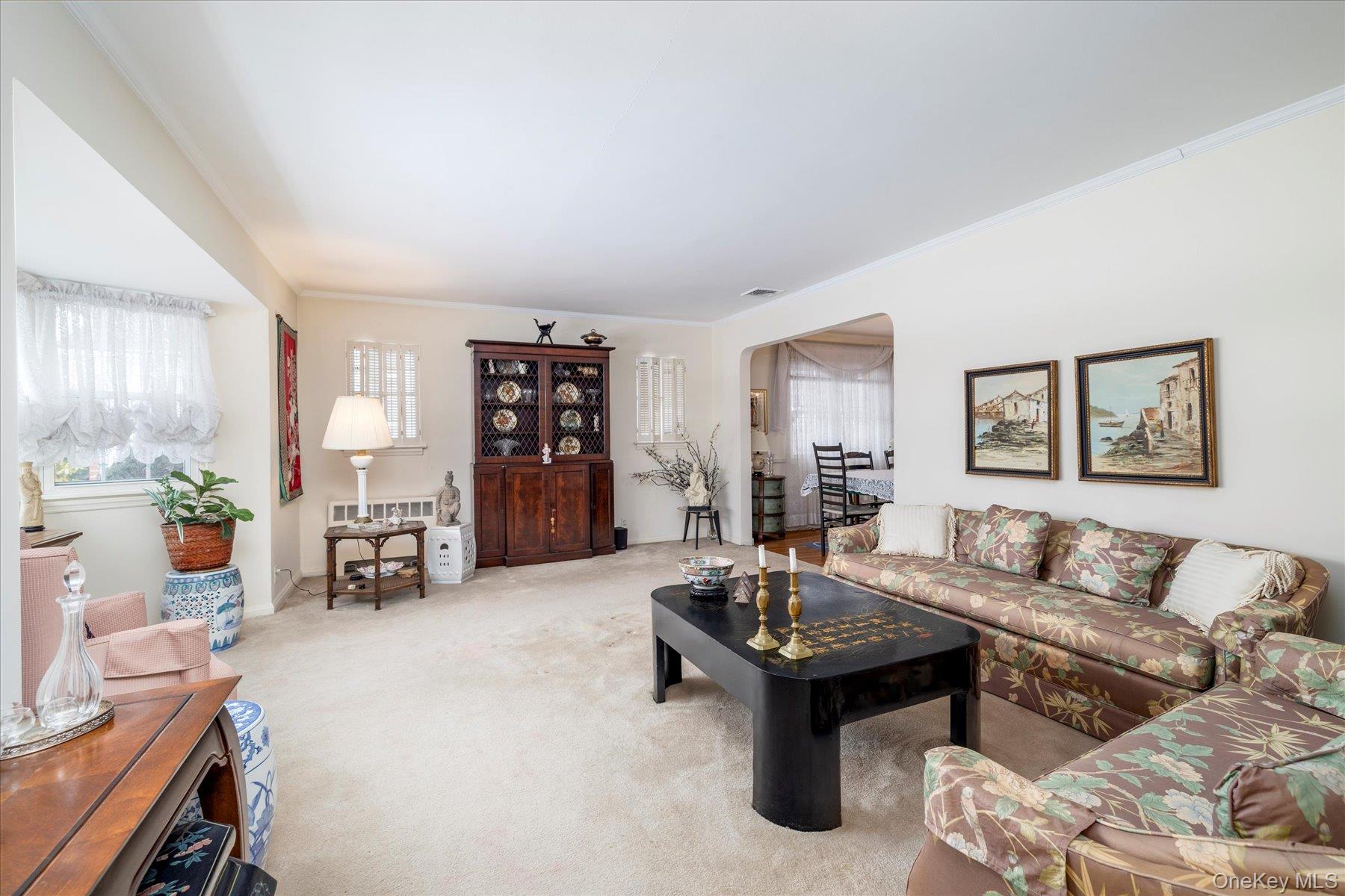 36 Wellsboro Road Valley Stream, NY 11580 - Photo 4 of 15 a living room with furniture and a table