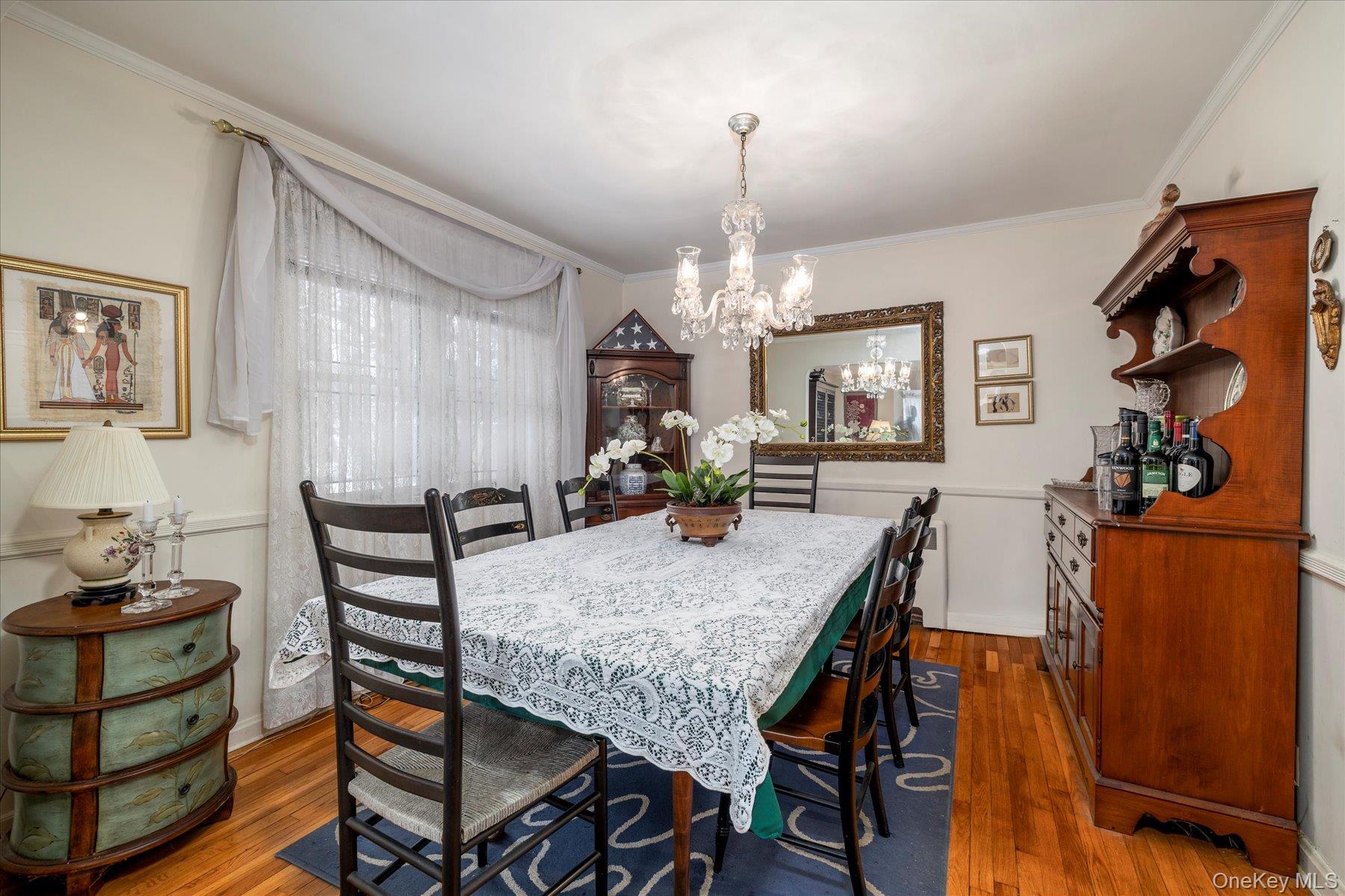 36 Wellsboro Road Valley Stream, NY 11580 - Photo 5 of 15 a view of a dining room with furniture and chandelier