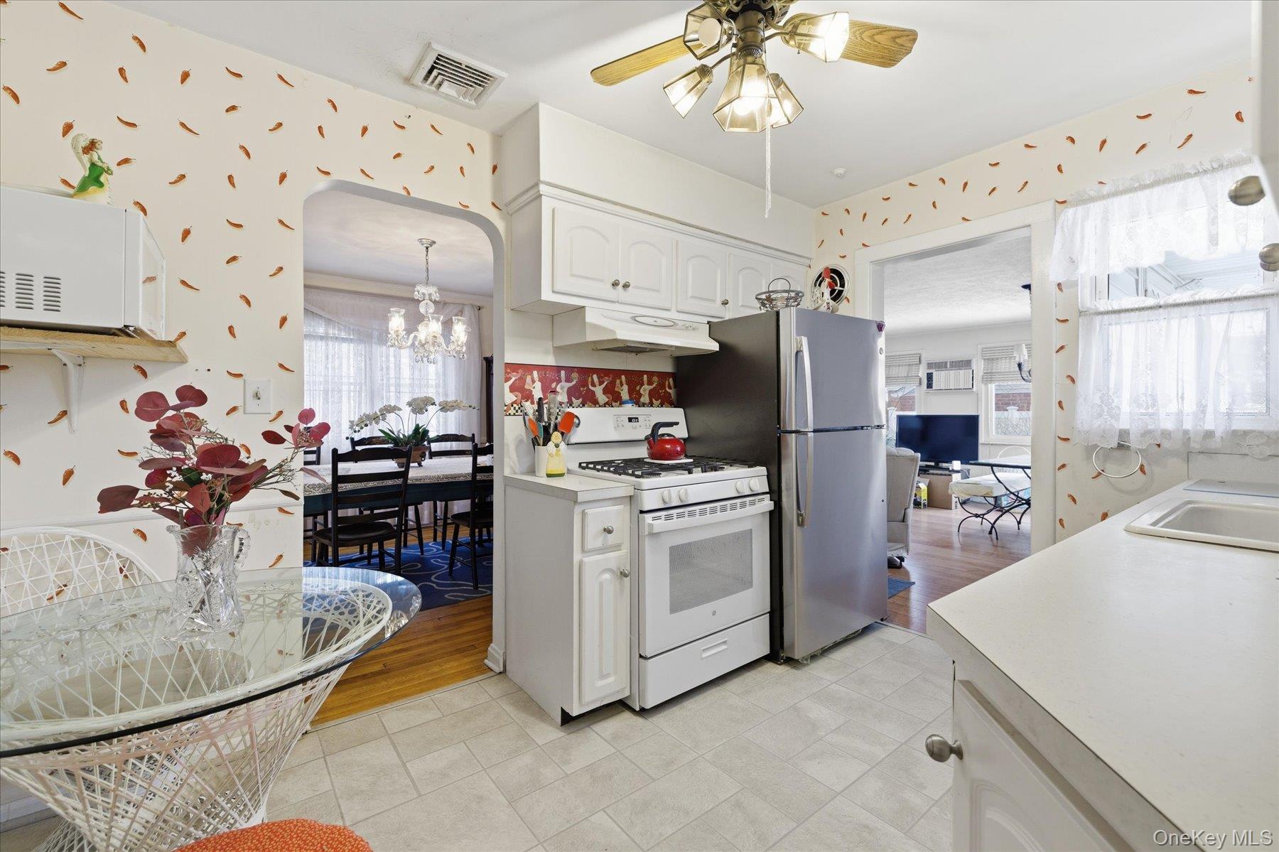 36 Wellsboro Road Valley Stream, NY 11580 - Photo 8 of 15 a kitchen with refrigerator and cabinets