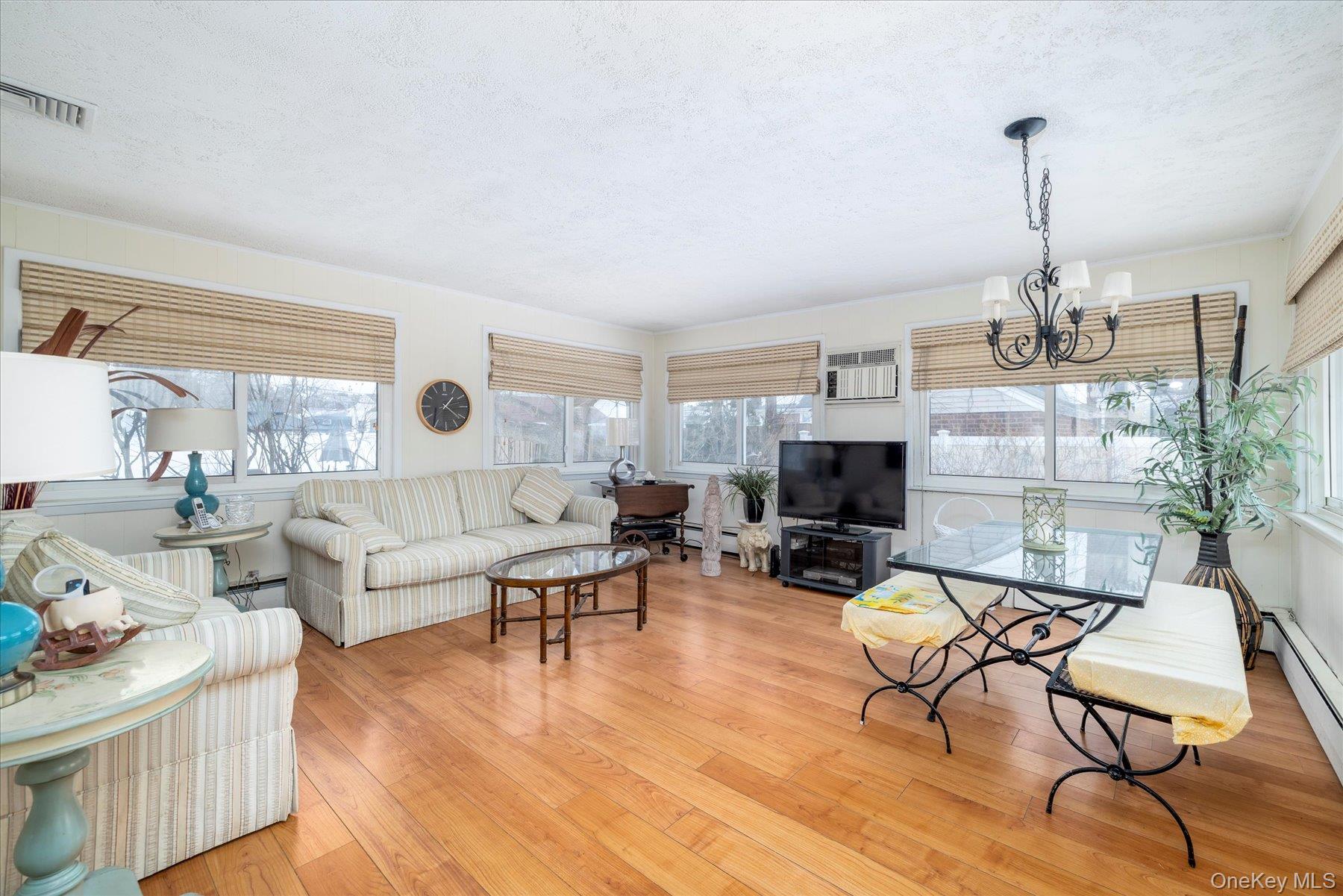 36 Wellsboro Road Valley Stream, NY 11580 - Photo 9 of 15 a living room with furniture and a fireplace