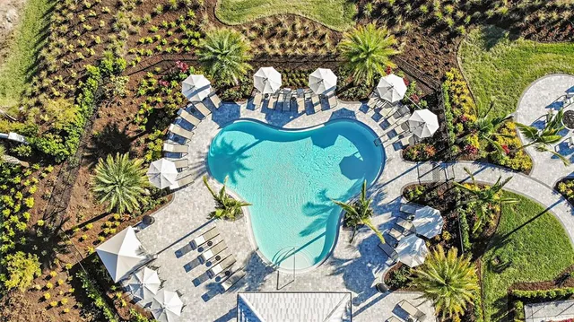 a view of a swimming pool with a patio