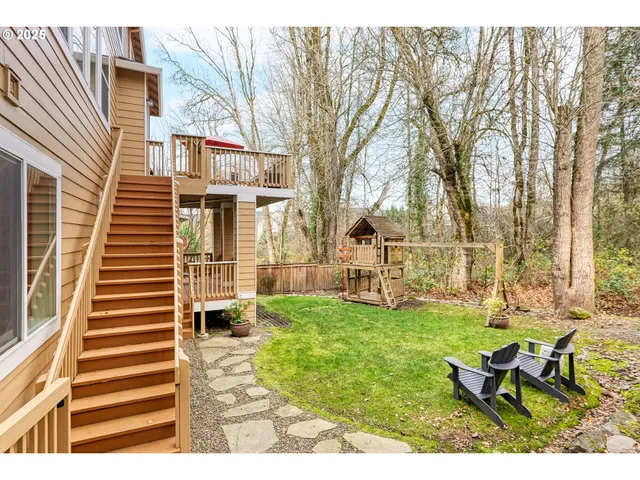 a view of backyard of house with outdoor seating