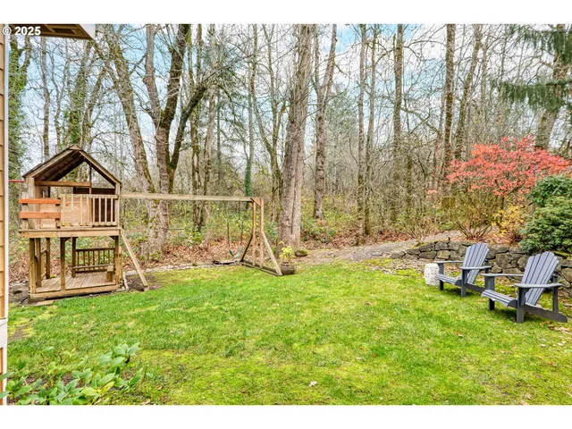 a view of a house with backyard porch and sitting area