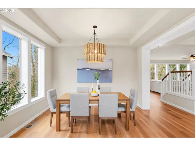 a view of a dining room with furniture window and wooden floor