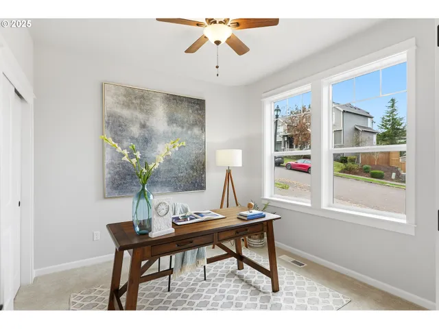 a view of a workspace with furniture