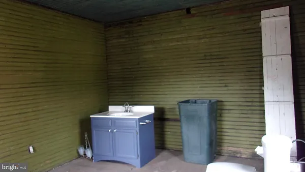 a view of an empty room with a fireplace