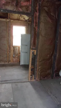 a view of an empty room with a fireplace