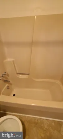 an empty room with a empty space and window