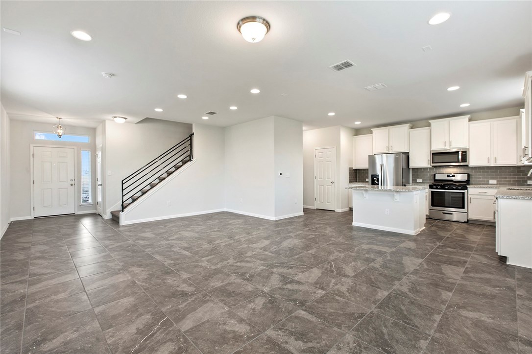 366 Silver Springs Bend Kyle, TX 78640 - Photo 1 of 1 a view of kitchen with kitchen island and stainless steel appliances