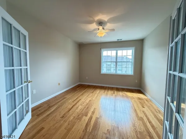 a kitchen with a sink a refrigerator and cabinets