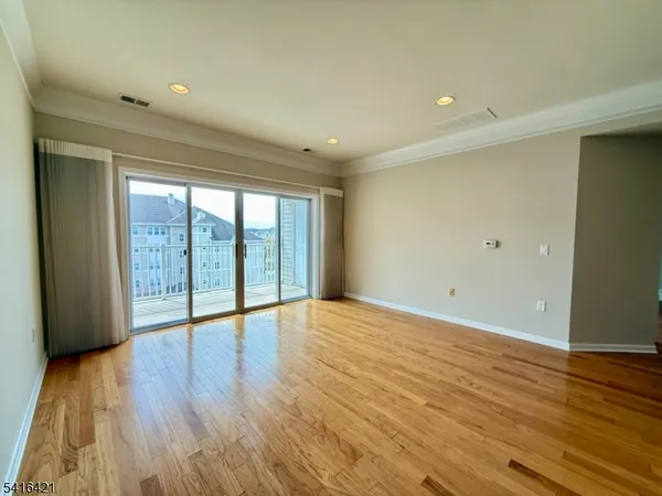 a kitchen with stainless steel appliances a stove a sink a microwave and cabinets