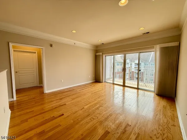 an empty room with a empty space and windows