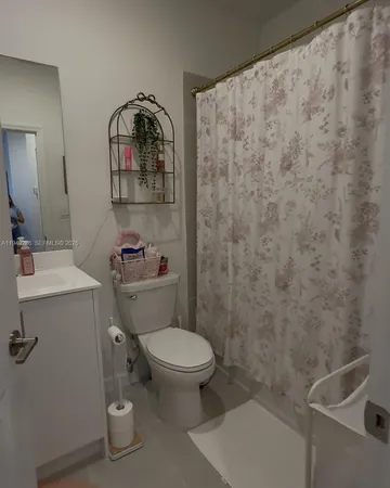 a bathroom with a toilet and a sink