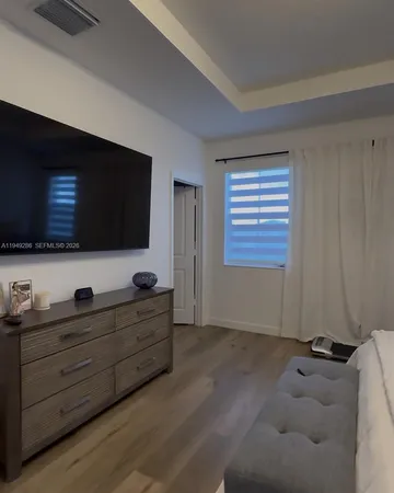 a room with furniture and flat screen tv