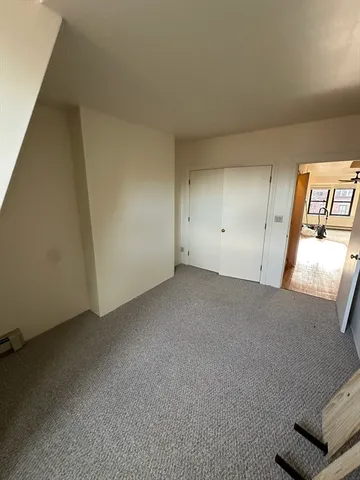 an empty room with a bench