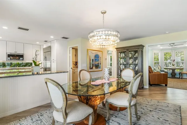 a living room with furniture ceiling fan and a window