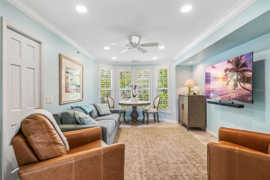 22 Seawatch Drive Boca Grande, FL 33921 - Photo 13 of 72 a living room with furniture ceiling fan and a window