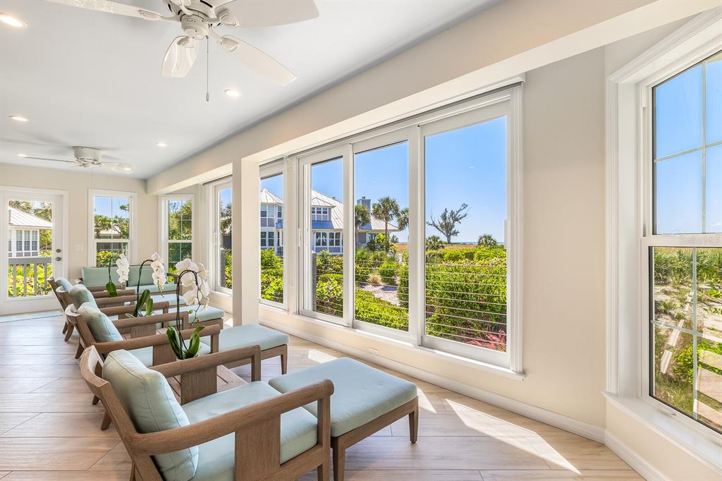 22 Seawatch Drive Boca Grande, FL 33921 - Photo 15 of 72 a living room with furniture and large windows