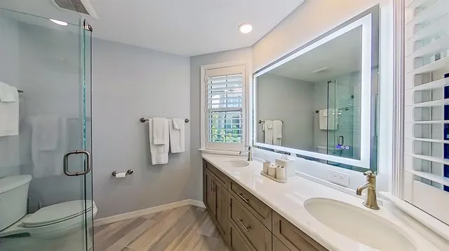 a bedroom with a large bed and a large window