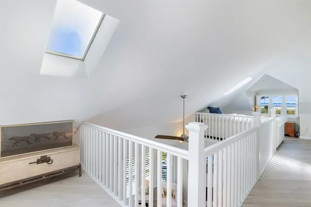 a spacious bedroom with a bed and furniture