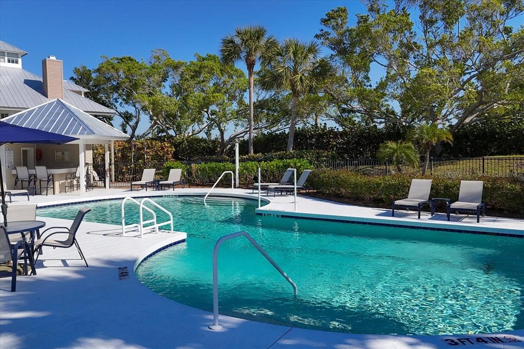22 Seawatch Drive Boca Grande, FL 33921 - Photo 43 of 72 a view of a swimming pool with a patio