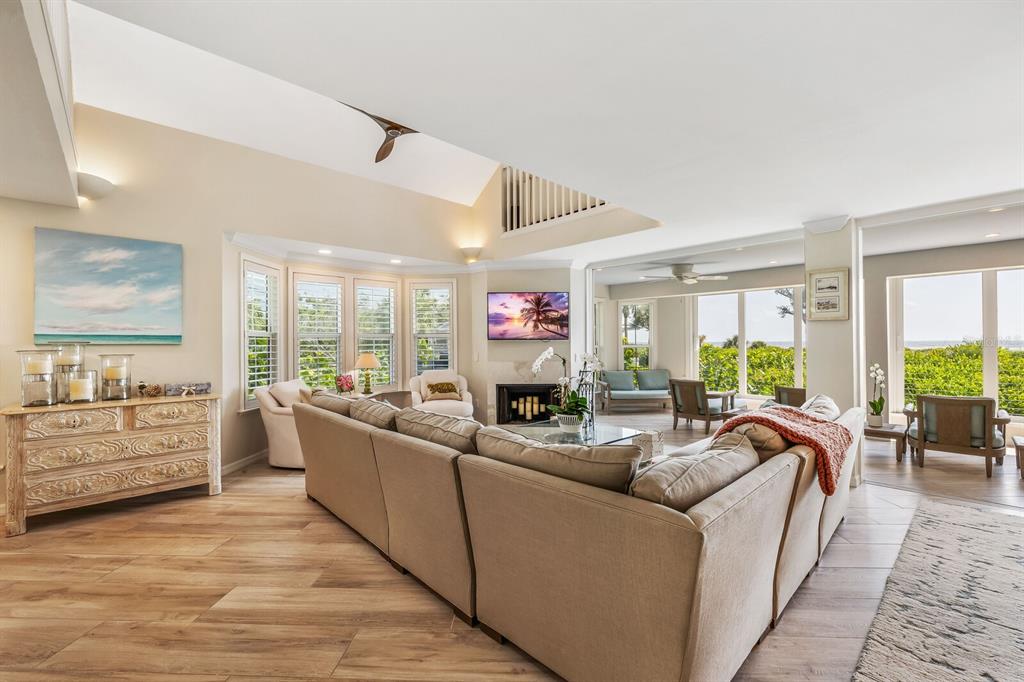 22 Seawatch Drive Boca Grande, FL 33921 - Photo 5 of 72 a living room with furniture large windows and wooden floor