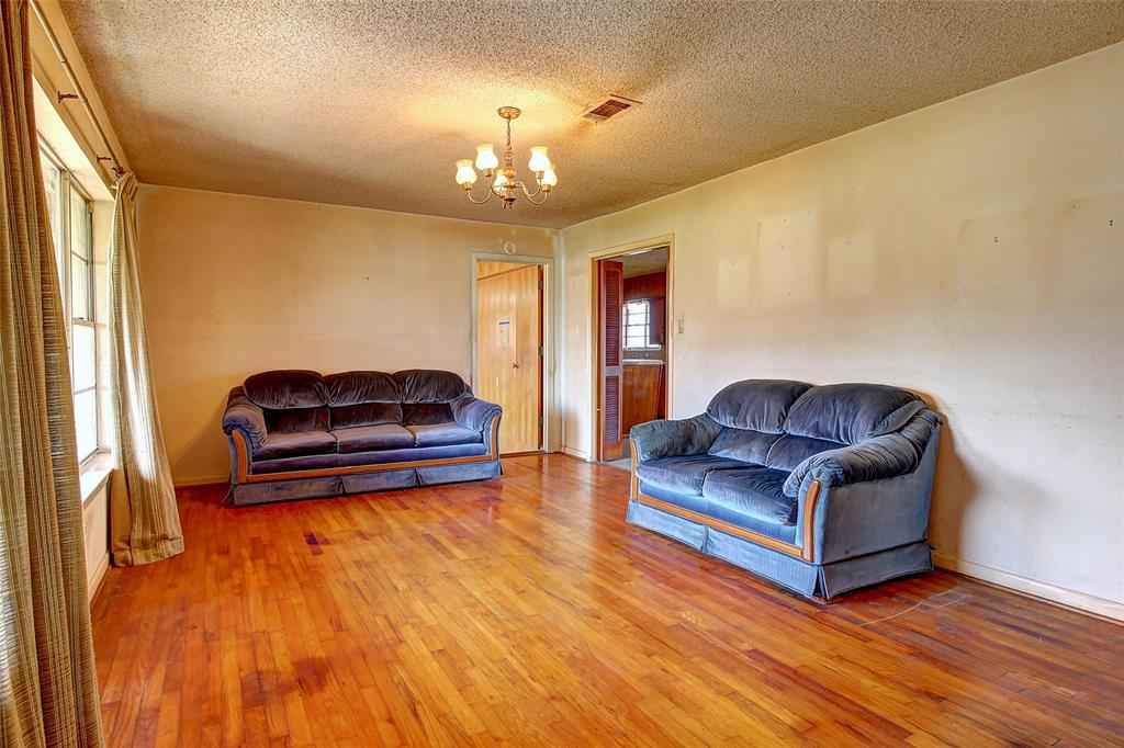 512 North Sherley Road Anna, TX 75409 - Photo 6 of 20 a living room with furniture and a chandelier