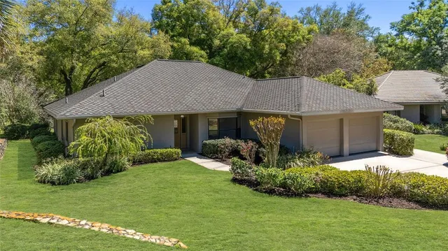 a view of a house with a yard and plants