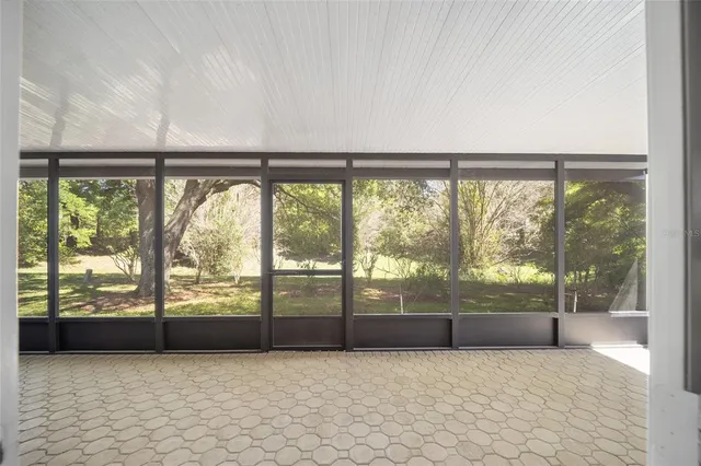 a view of an empty room with a large window